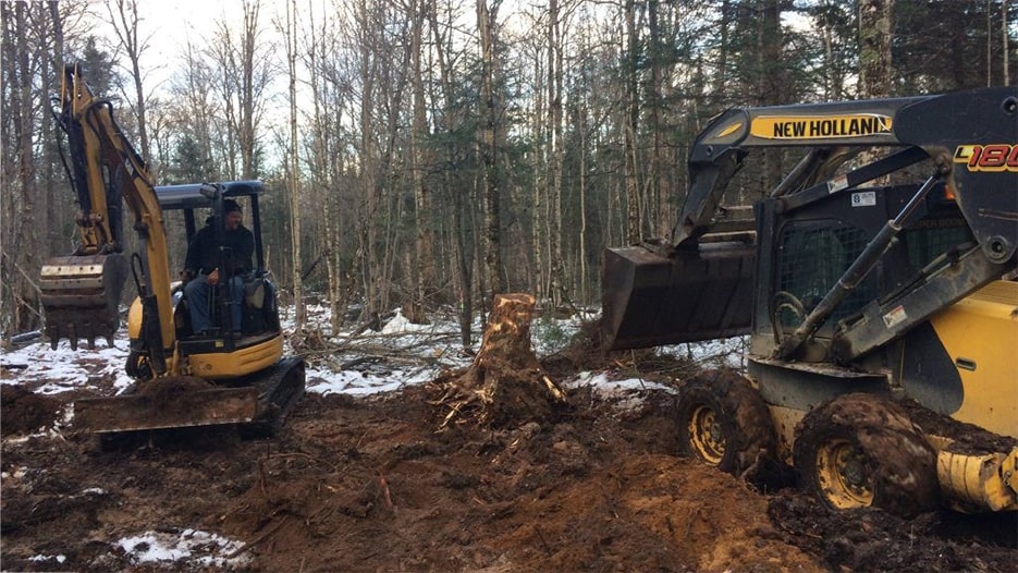 Large construction equipment working on the trails